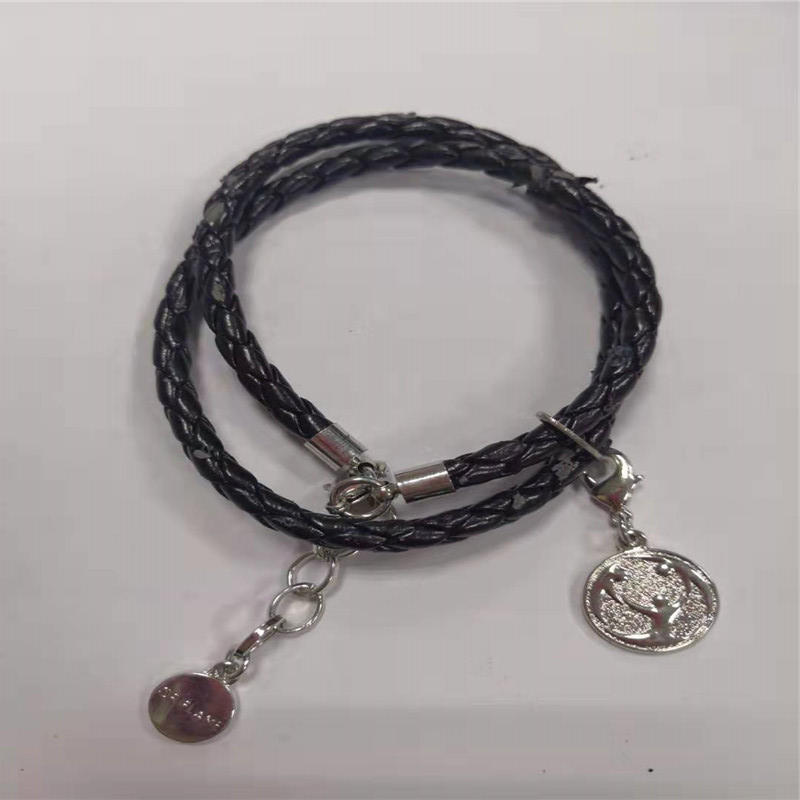 Coin pendant with woven bracelet